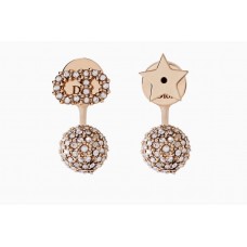 Pendientes colgantes asimétricos con estrella CD y cristal blanco Dior La petite Tribale en oro rosa
