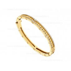 Brazalete Bvlgari B.zero1 Rock de oro amarillo de 18 quilates con espiral tachonada y pavé de diamantes en los bordes