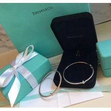 Brazalete de diamantes femeninos con decoración liliácea de flor de lis Tiffany, plata/oro rosa